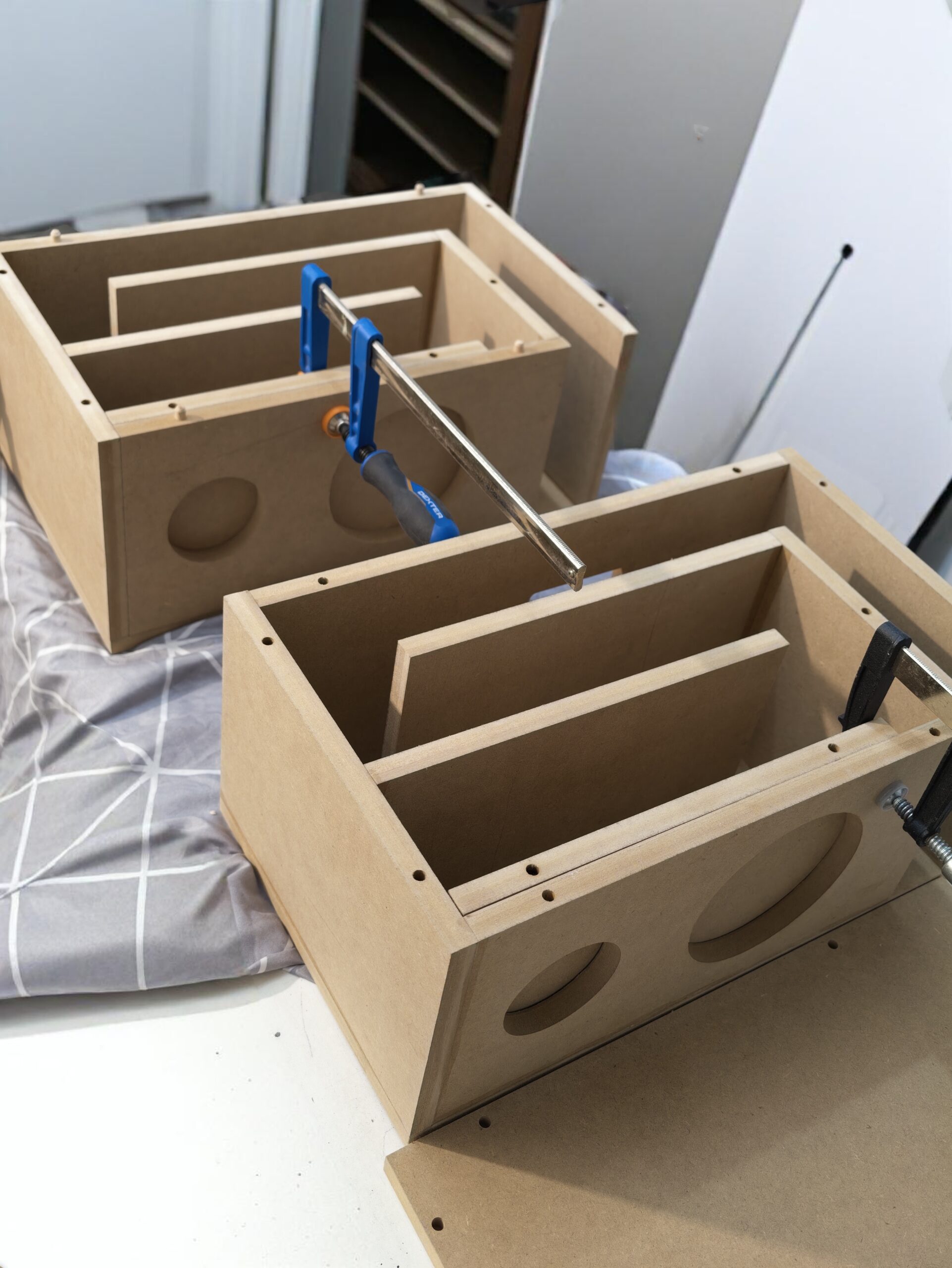 Real workshop photograph: folded internal paths in compact cabinets.